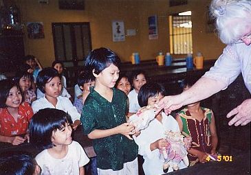 Vietnamese children enjoy their gifts.